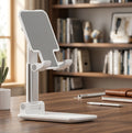 Natural wooden phone stand on cozy minimalist desk, warm sunlight, indoor plants, Scandinavian home decor style, smartphone resting on stand, premium lifestyle product photography